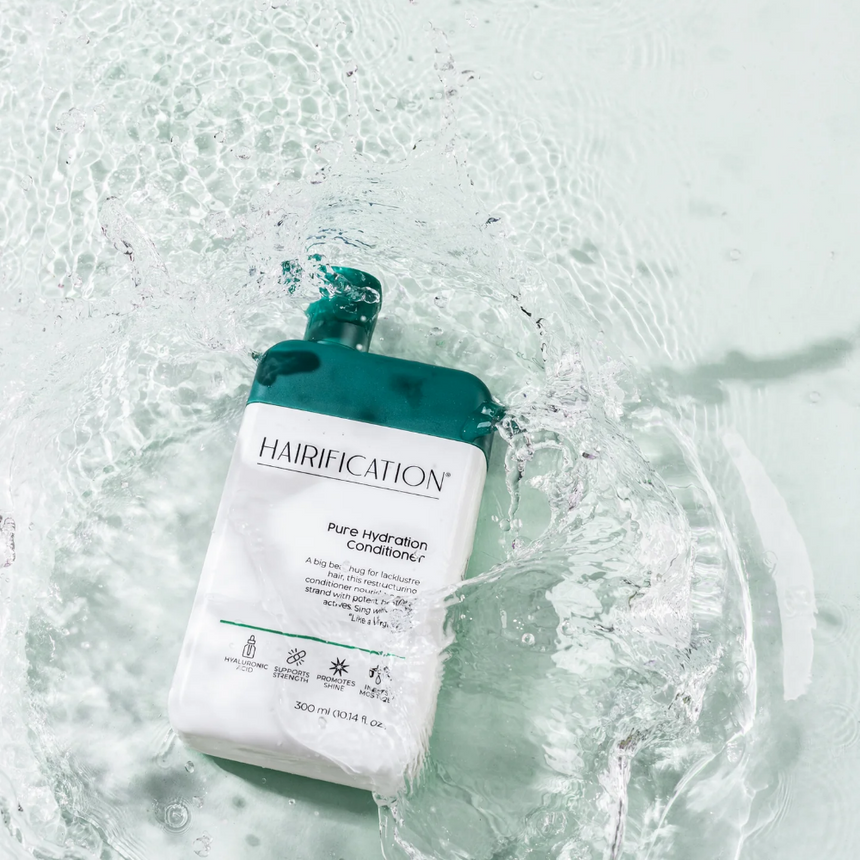 Hairification Pure Hydration Conditioner displayed against a water-inspired backdrop.