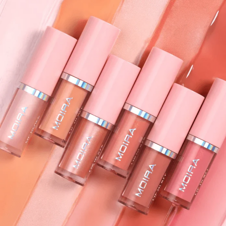 MOIRA Lip Glaze Oil Lip Plumper displayed against product swatches.