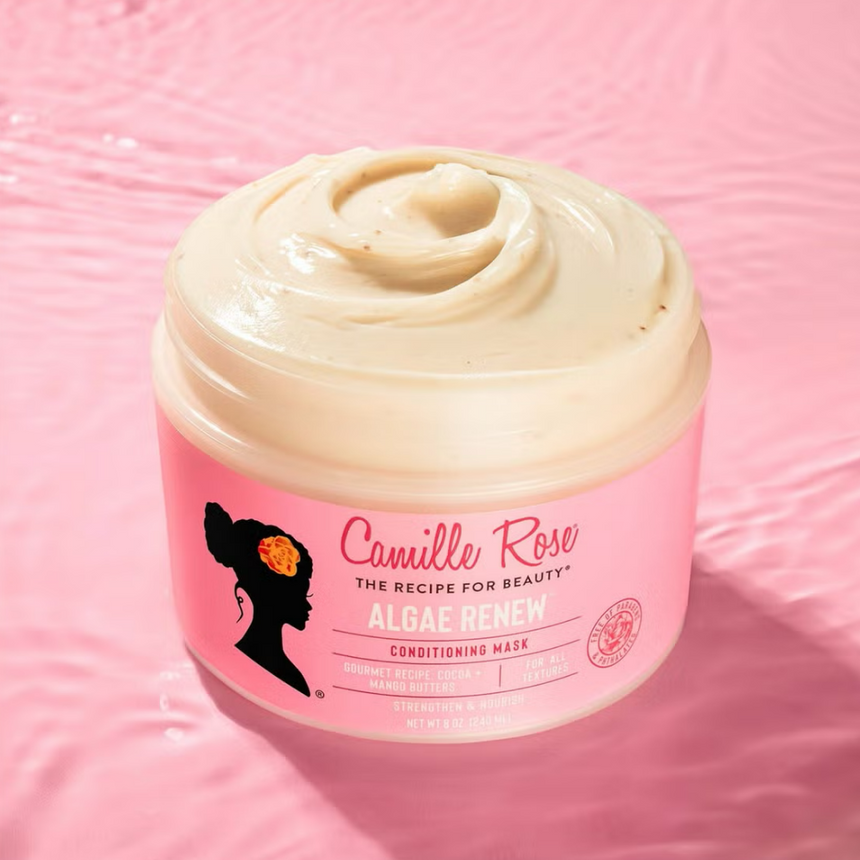 Camille Rose Algae Renew Deep Conditioning Mask displayed against a pink water-inspired backdrop.