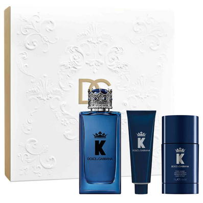 Dolce & Gabbana K fragrance gift set featuring a blue perfume bottle, a blue tube, a blue deodorant container, and a white embossed box with a gold-tone border and large DG logo.
