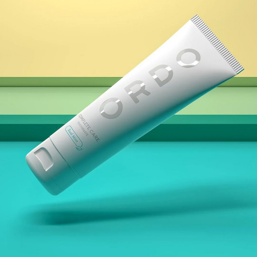 Ordo Complete Care Toothpaste Dual Mint displayed against a colourful backdrop.