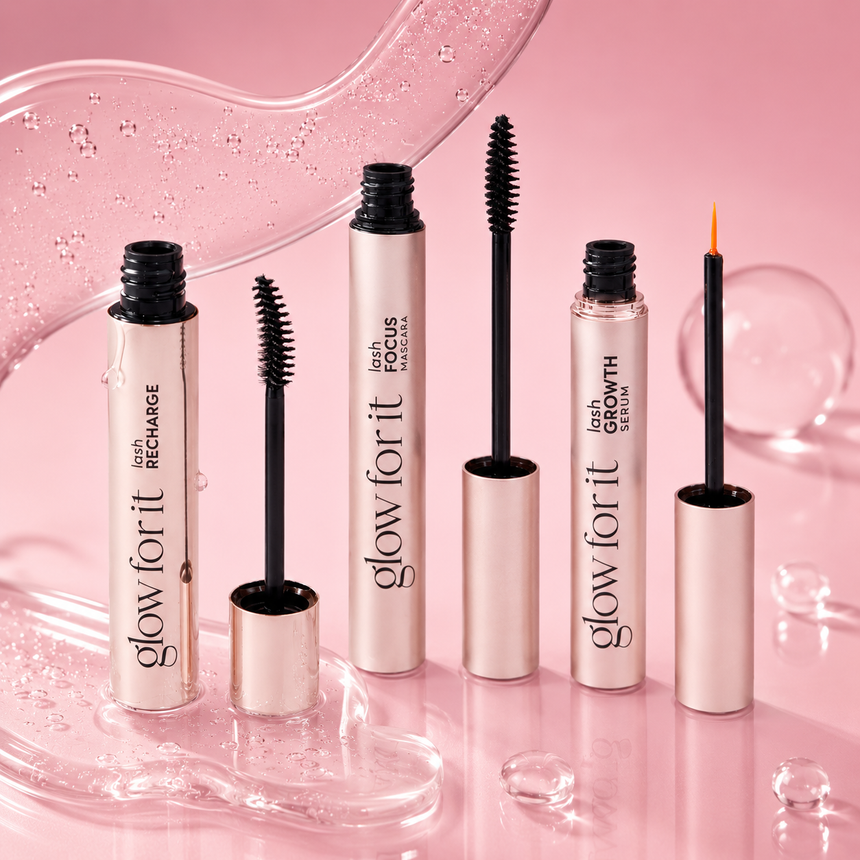 Glow For It Products featuring Lash Focus Mascara, Lash Growth Serum and Lash Recharge displayed against a glossy pink backdrop with clear, bubble-like textures.