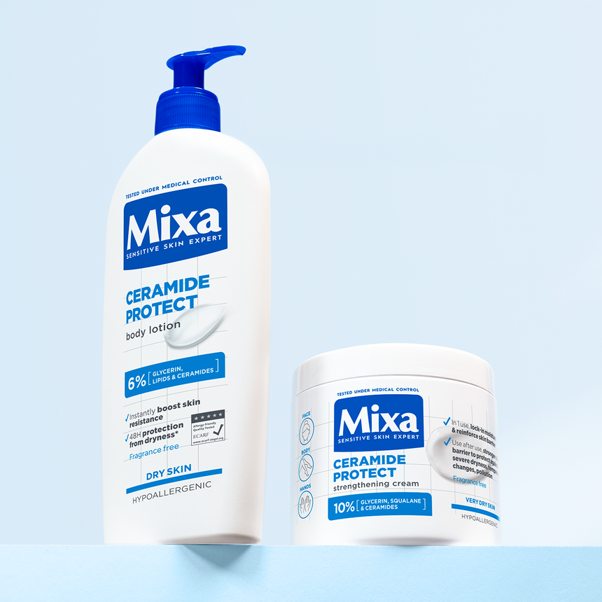 Mixa Ceramide Protect Body Lotion and Strengthening Cream displayed against a soft blue background.