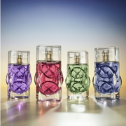 Multiple Michael Kors Fragrances on a ombré background.