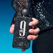 A singular Afnan fragrance is being presented in a studio setting.