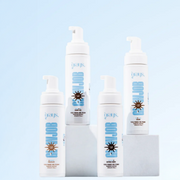 A variety of Grays products displayed on white plinths against a light blue backdrop.