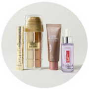 Multiple L'oreal Paris products displayed on a white studio backdrop.