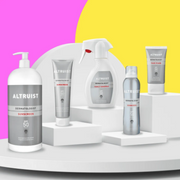 A variety of Altruist Products presented on white slabs and a yellow and pink background display.