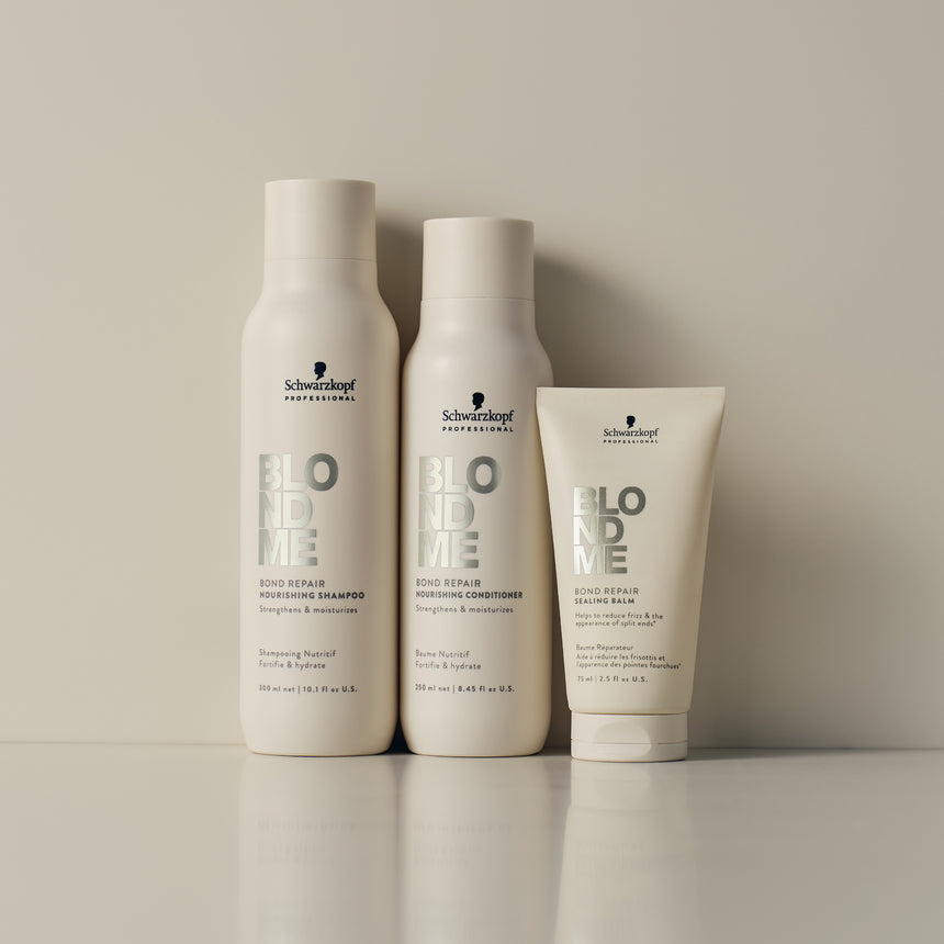 A variety of Schwarzkopf Professional Blond Me products featuring Shampoo, Conditioner and Sealing Balm in a light studio setting.