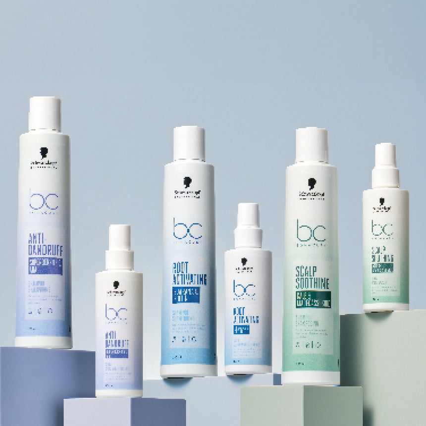Schwarzkopf Professional products displayed on colourful pillars in a light blue setting.