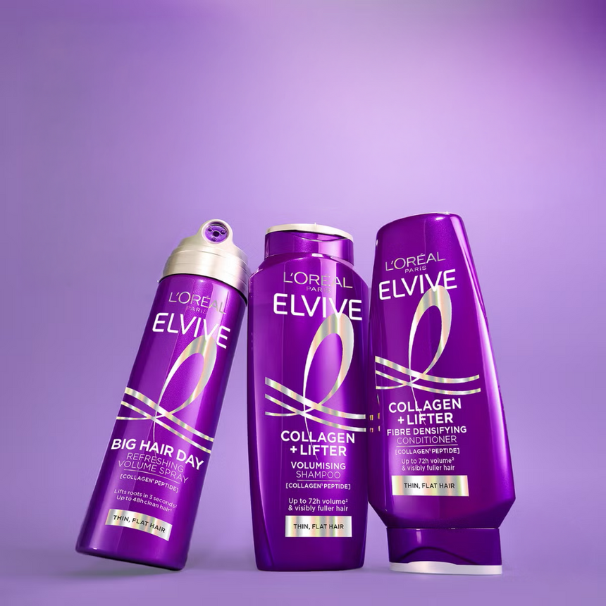 L’Oréal Paris Elvive Collagen + Lifter volumising shampoo, conditioner and Big Hair Day spray displayed against a purple background.