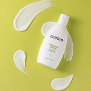 ZEROID Intensive Lotion surrounded by the lotion texture against a fresh lime-green backdrop.