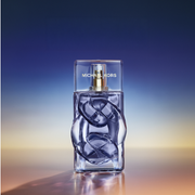 New In Micheal Kors Fragrance displayed on a ombre backdrop.