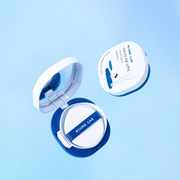Round Lab Birch Juice Moisturising Sun Cushion SPF50+ displayed on a light blue backdrop.
