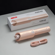 TYMO Curlgo Cordless Auto Curling Iron Rose Gold displayed on a dark studio surface.