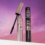 Featured are two Maybelline Sky High Mascaras displayed on a pink and purple sky-inspired setting.