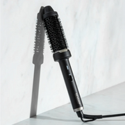 Revamp 40mm Big Hot Brush displayed against a marble backdrop.