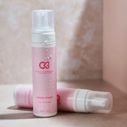 Cocoa Brown Fresh Start Self Tan Eraser bottles displayed against a soft neutral backdrop.