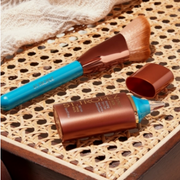 St. Tropez products displayed against a wooden table.

