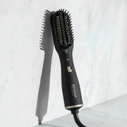 Revamp Deepform 2-in-1 Dry & Style Hot Air Styler displayed against a clean marble background.