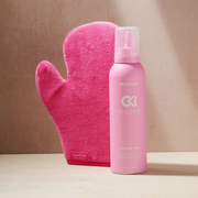 Cocoa Brown Self Tan Mousse and Tanning Mitt displayed against a beige backdrop with natural lighting.