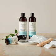 Sukin Deep Cleanse products displayed with accessories against a soft beige backdrop.