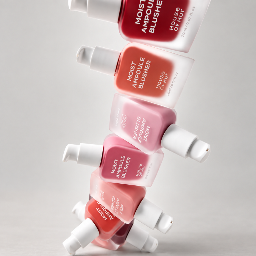 A variety of House Of Hur Moist Ampoule Blusher showcased against a soft grey studio backdrop.