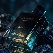 Rayhaan Nocturno Elixir Frangrance displayed against a dark blue mysterious backdrop.