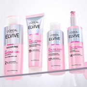 L'oreal Paris Elvive Glycolic Gloss haircare displayed on a crisp white background.