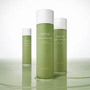 TIRTIR Matcha Skin Toner in three bottles displayed on a reflective soft green surface against a clean white backdrop.