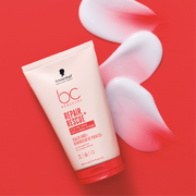 Schwarzkopf Professional Repair Rescue hair treatment displayed on a red background with creamy product swatches.