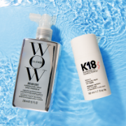 Color Wow Dream Coat and K18 haircare products displayed with rippling water against a bright blue background.
