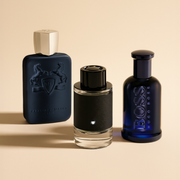 A selection of men’s fragrances from Parfums de Marly, Montblanc and BOSS displayed on a warm beige background.